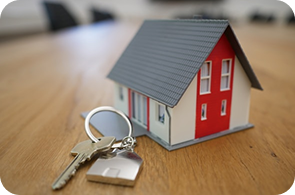 House model with keys, representing home loan