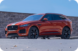 Luxury car on a road, representing vehicle insurance